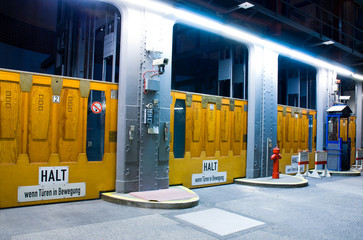 Three elevator gates in a tunnel