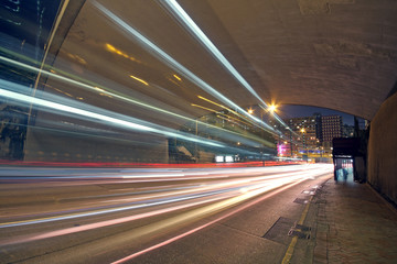 Fototapeta na wymiar blurred bus light trails in downtown night-scape