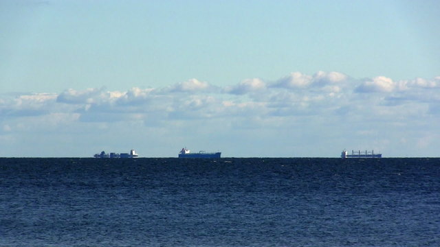 cargo ships waiting for the pilot