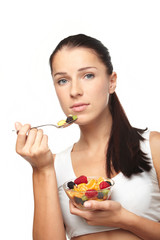 woman eating fruit salad