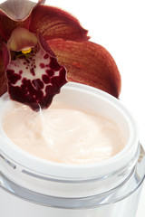 Face cream and orchid flower