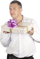 The happy man on a white background with a celebratory gift