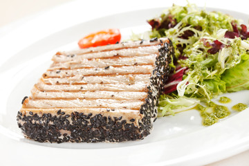 salmon steak with salad