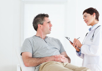Female doctor talking to a patient