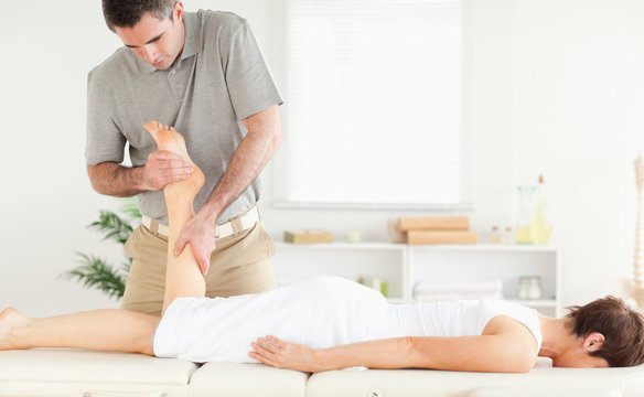 A female customer's leg being massaged