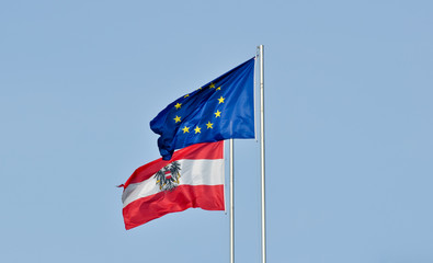 flags of austria and the european union against blue sky