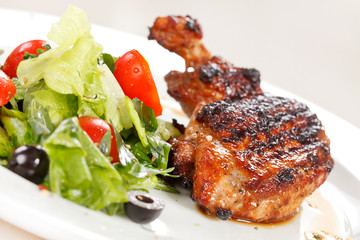 Roasted chicken leg with salad