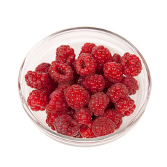 Red raspberries in a glass bowl