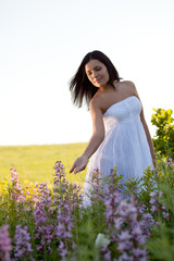 woman walking along the field