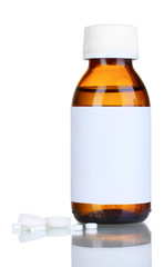 Liquid medicine in glass bottle and pills isolated on white
