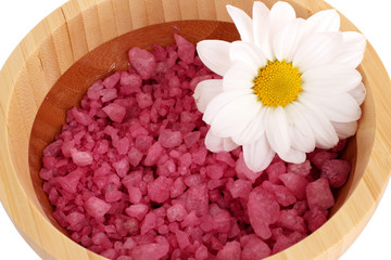 Flower and bath salt on white background