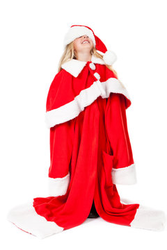 little girl in a oversized santa costume