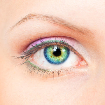 Eye with pink and green make-up