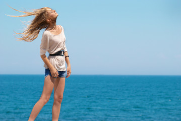 Naklejka premium Pretty blond girl outdoors