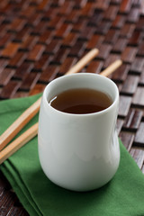 White cup of green tea