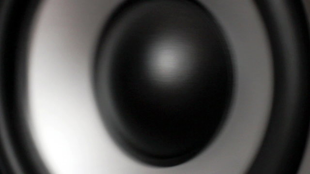 Closeup at moving sub-woofer. Speaker part.