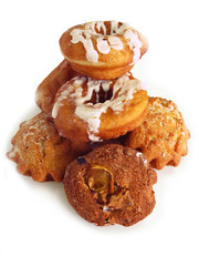 Donuts and rolls lie in wattled in a basket