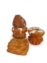 Donuts and rolls lie in wattled in a basket