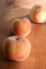 Naklejka na ściany i meble Peach Fruits On Wood