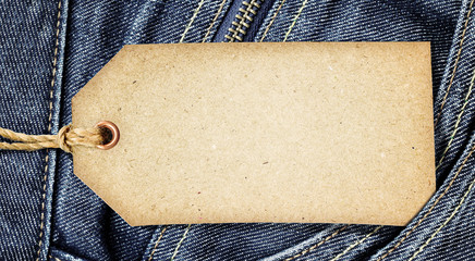 Vintage paper tag on blue denim