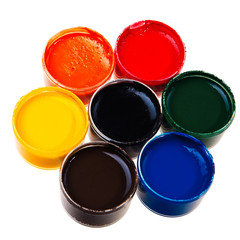 Colorful school water paints isolated over white background.