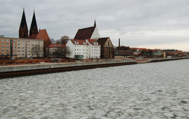 Fototapeta premium winter river in historic town