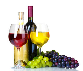 Fototapeta premium Ripe grapes, wine glasses and bottles of wine isolated on white