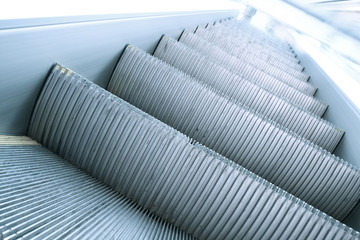 gray steps of modern escalator stairway