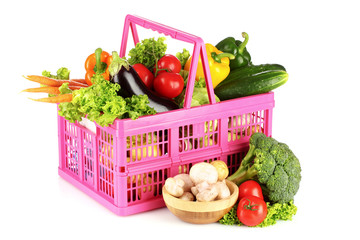 vegetables in a basket isolated on white