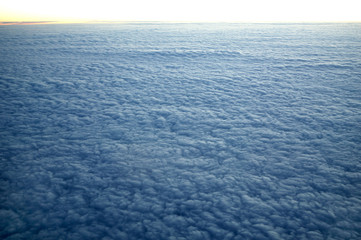 Fototapeta na wymiar Blue cloudscape aerial view from aircraft