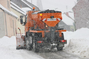 Winter service vehicle in use in heavy snow-fall