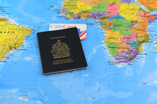 Canadian passport with care card on the global map