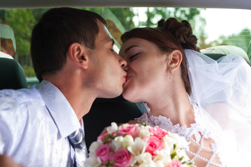 Bride and groom kissing