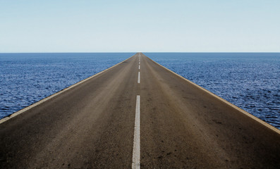 straight road in the middle of the sea