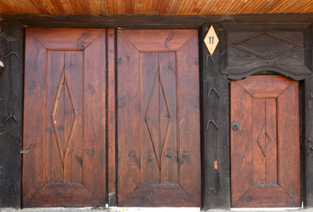 old wooden door gate with metal handles