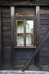 old wooden window on a dark timber wall