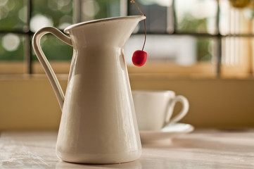 Cherry Hanging from a vase