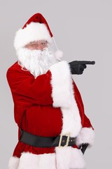 Santa Claus pointing to blank space
