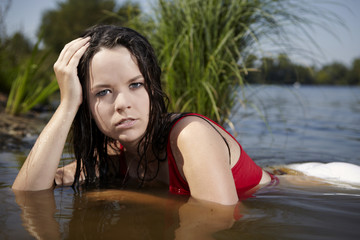 Teenage beauty in lake