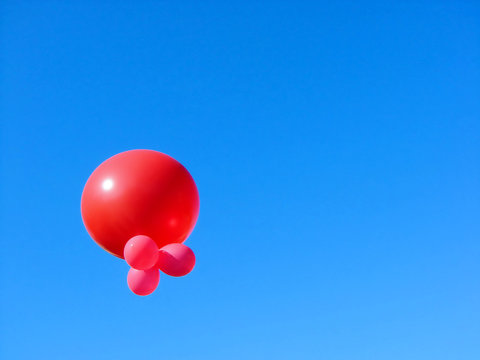 pink red sphere in the blue sky
