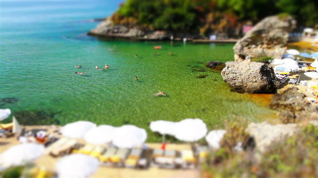 A view of a rocky beach from a high angle. Tilt shift effect