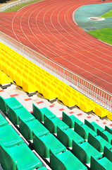 rows of plastic chairs at the stadium