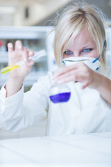 Closeup of a female researcher carrying out experiments in a lab