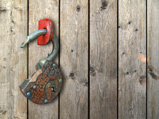 old, rusty hinged lock.