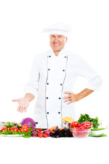 handsome senior chef with vegetables