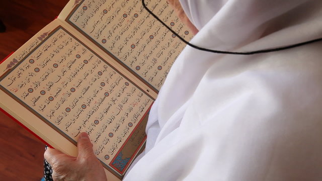 Muslim women read the Quran
