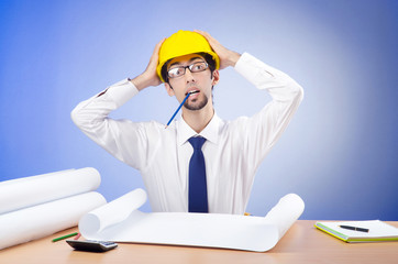 Young engineer looking at drawings