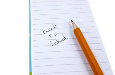 Back to School written on notebook paper with pencil.