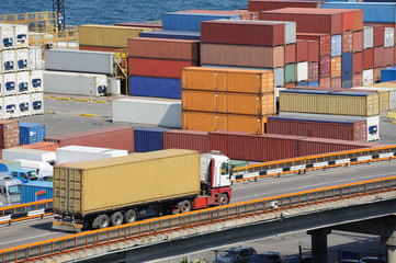 truck transports container to warehouse near the sea