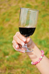 Woman holding glass of wine
